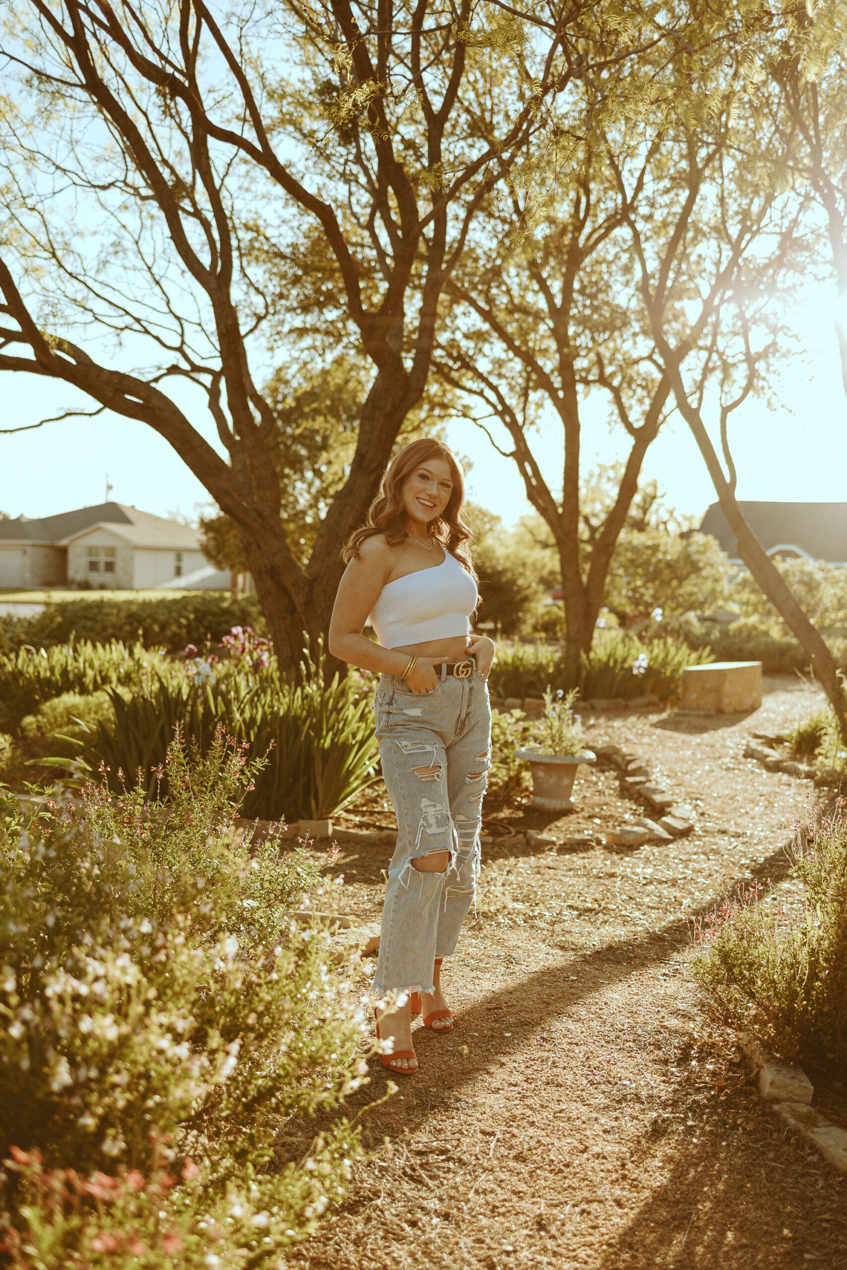 Dreamy senior session during golden hour in a garden in Abilene, TX