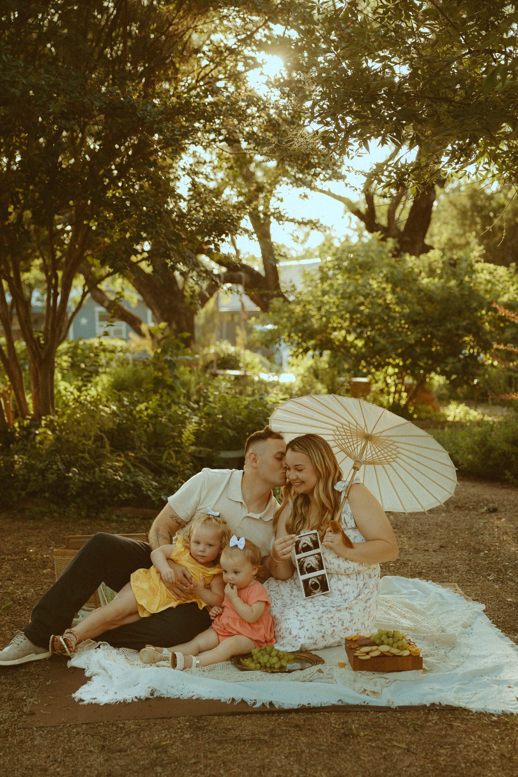 Pregnancy announcement styled shoot in a garden in Abilene, TX