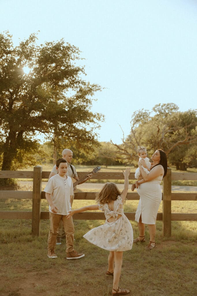 Intimate family session with a guitar during golden hour in Buffalo Gap, TX