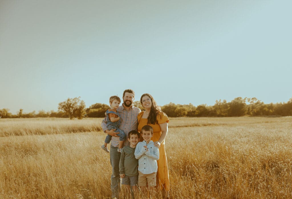 Golden hour Autumn Auras fall family mini session in a field in Buffalo Gap, TX
