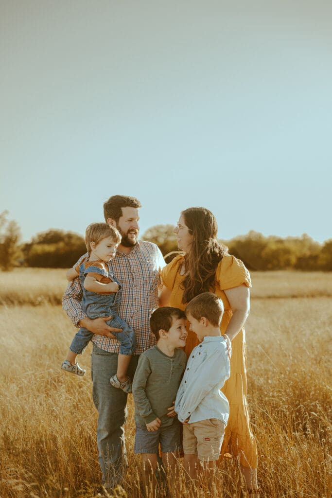 Golden hour Autumn Auras fall family mini session in a field in Buffalo Gap, TX