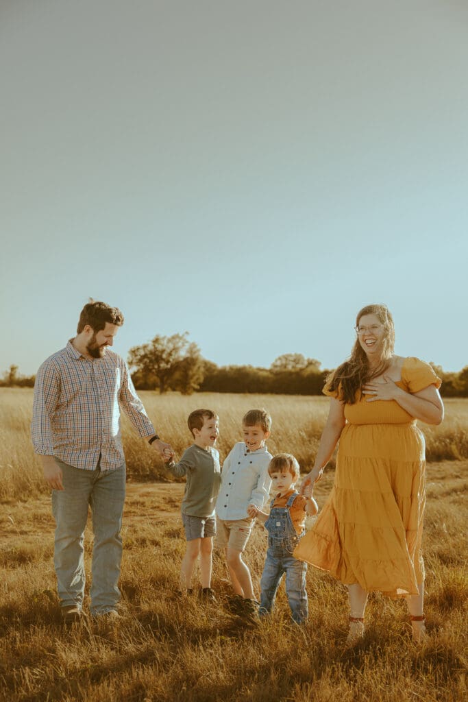 Golden hour Autumn Auras fall family mini session in a field in Buffalo Gap, TX