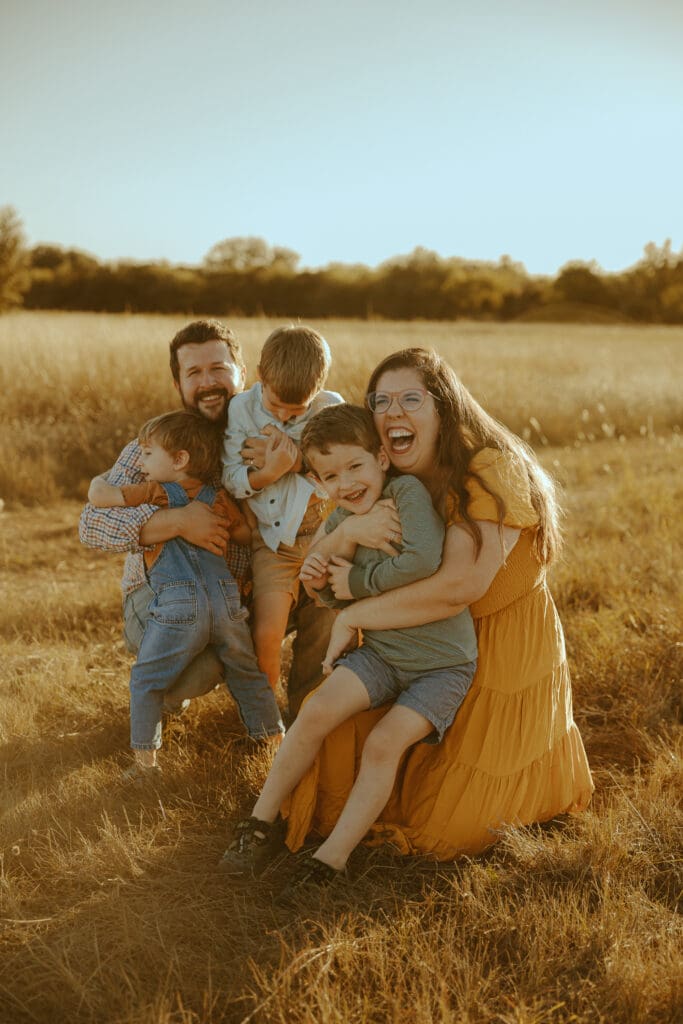 Golden hour Autumn Auras fall family mini session in a field in Buffalo Gap, TX
