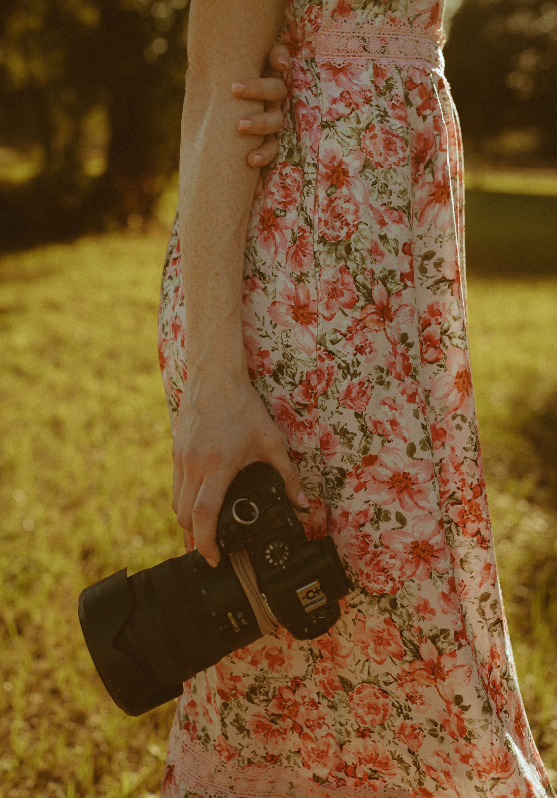 Photographer holding a camera up close during a branding session