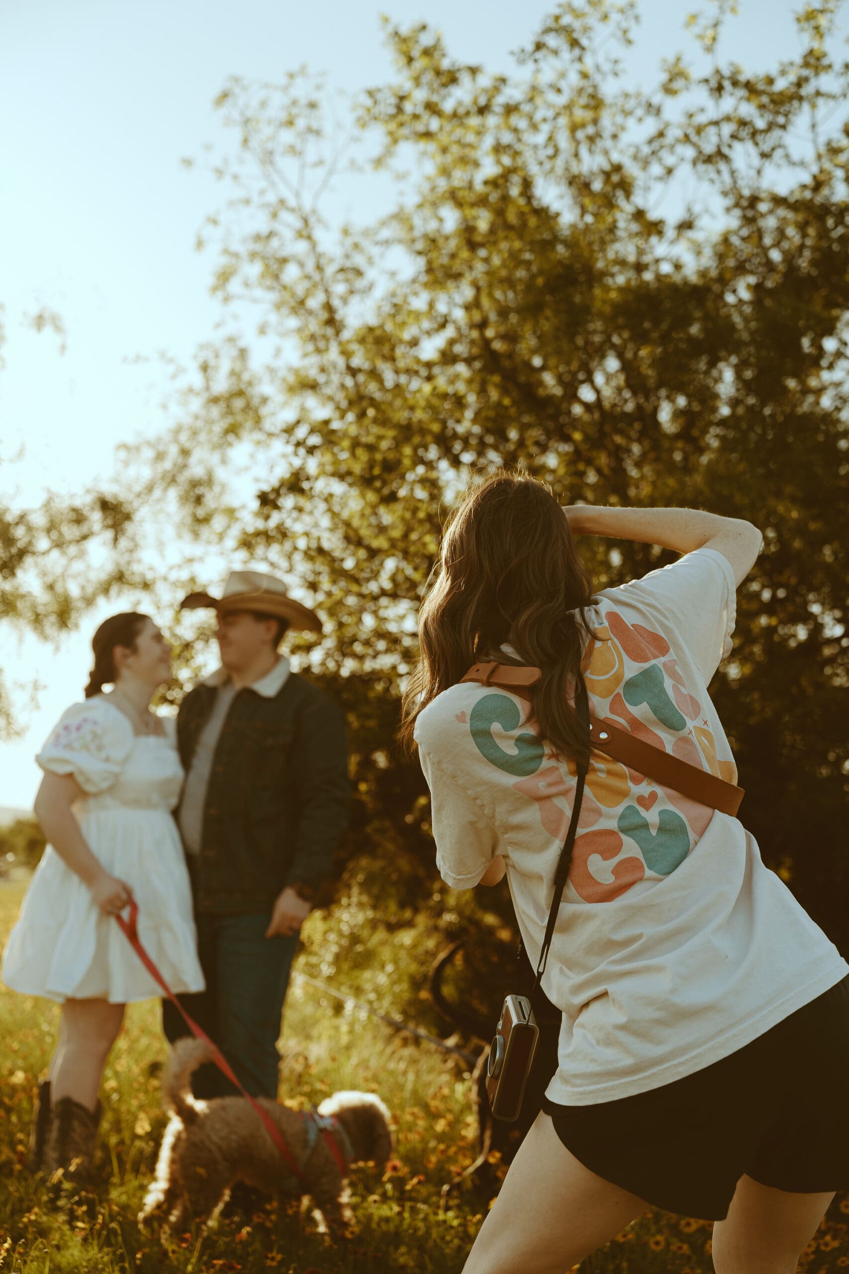 Behind-the-scenes photo of Morgan Rose Photography working during a session, showing the dedication and care photographers put into each client experience.