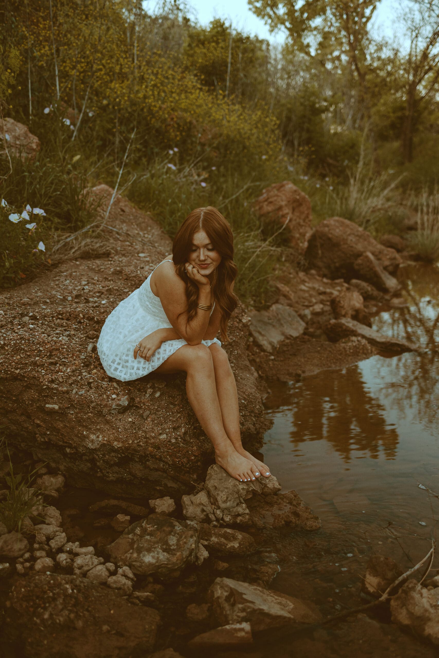 Dreamy and whimsical senior session by a creek in Abilene, TX
