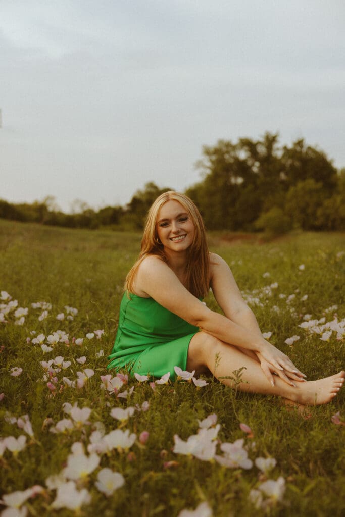 Dreamy senior session in a field with florals by a creek in Abilene, TX