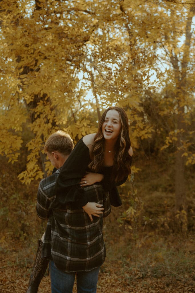 Golden, intimate fall-coded engagement session by a creek in Abilene, TX